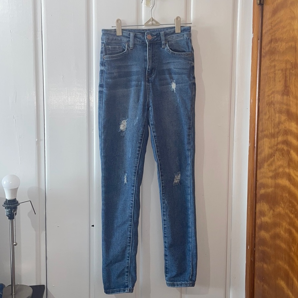 Blue slightly ripped jeans